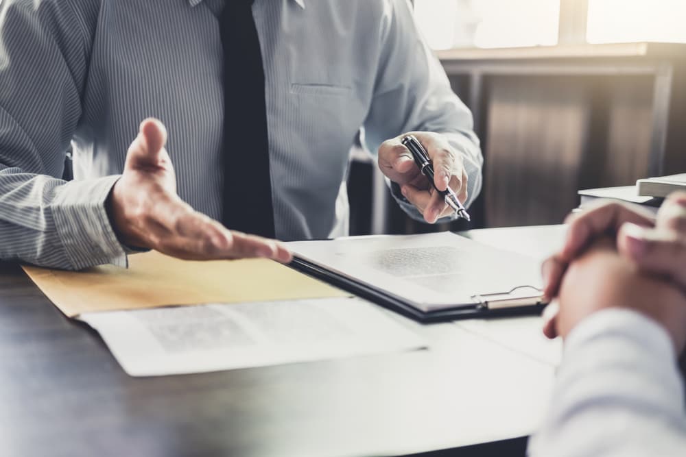 lawyer reviewing car accident paperwork