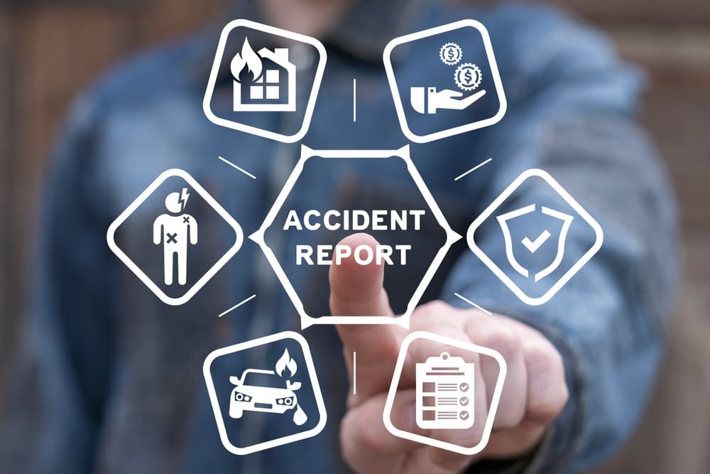 person selecting accident report button