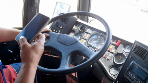 A truck driver driving while distracted