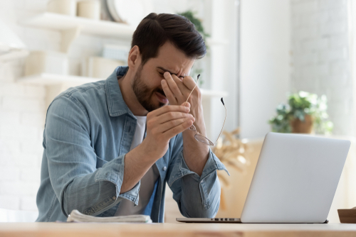 Frustrated employee working off the clock.