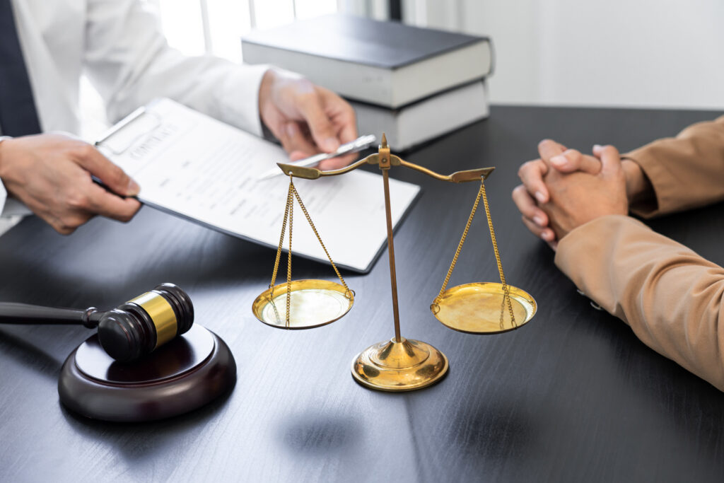 A San Mateo wage and hour lawyer discussing details with a client. 